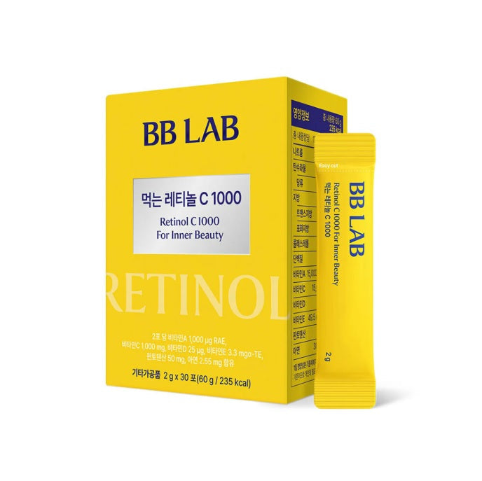 Жовта коробка з жовтим саше Ретинолу з колагеном BB LAB Retinol C 1000 стоїть на білому фоні.