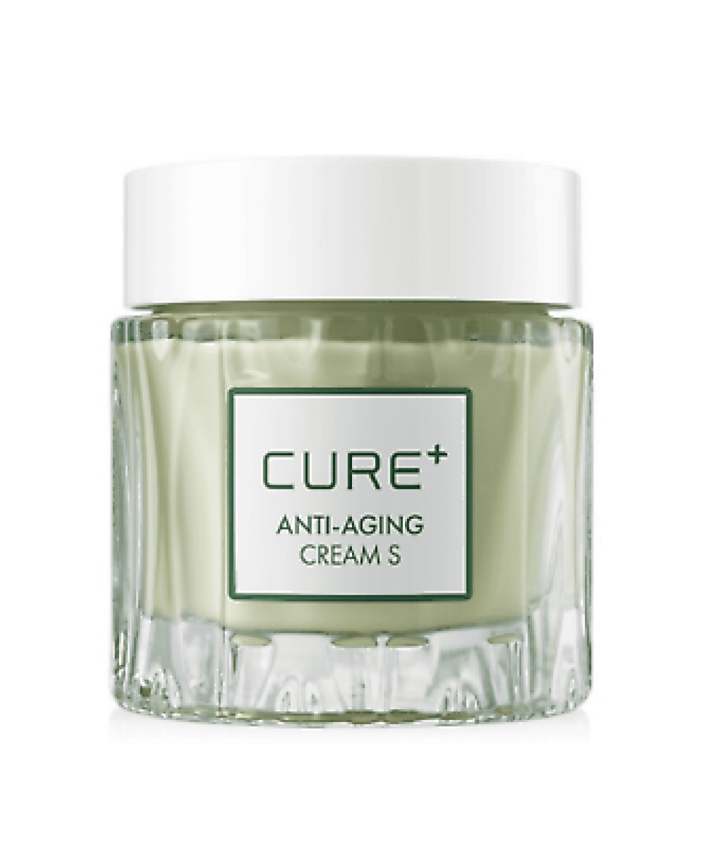 Прозора скляна баночка Cure Anti-Aging Cream з білою кришкою стоїть на білому фоні.